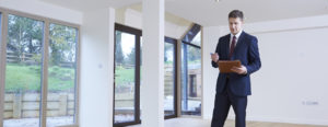 man conducting appraisal in home with lots of windows Turner Home Appraisals Denver