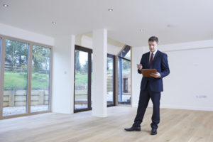 man conducting appraisal at home with lots of windows Turner Home Appraisals Denver